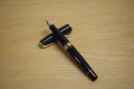 A Waterman Charleston converter fill fountain pen in black with gold trim having Waterman Paris