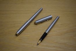 A Parker Sonnet Flighter converter fill fountain pen and rollerball pen with gold trim to the cap