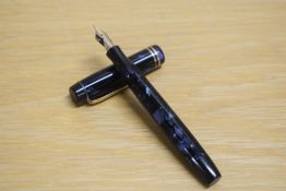 A Parker Duofold Junior button fill fountain pen in blue black marble with two cap bands having a