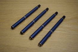 Three Parker Rialto converter fill fountain pens and a rollerball pen in Matte Navy