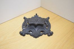 An Art Nouveau cast inkwell Reg No 368255 circa 1910