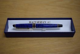 A boxed Waterman Expert converter fill fountain pen in Dune blue having Waterman France M nib