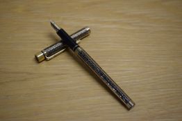 A Sheaffer TRZ Targa slim cartridge fill fountain pen in black and gold with etched patterned panels