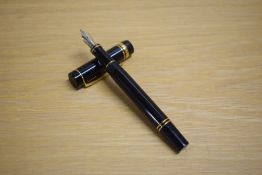 A Parker Duofold International cartridge fill fountain pen in black with gold trim having Parker 18K