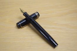 A Parker Duofold Special Streamlined button fill fountain pen in black with two bands to the cap