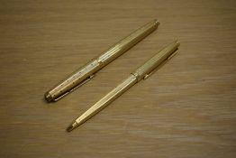 A Parker 75 converter fill fountain pen and ballpoint pen set in gold plated Perle design having