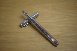 A Caran d'Ache Ecridor Cubrik converter fill fountain pen with guilloche design palladium plated