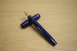 A Parker Duofold Senior button fill fountain pen in lapis lazulii with two gold bands to the cap