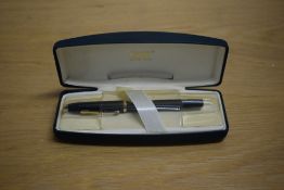 A boxed Cross Century aerometric fill fountain pen in matt black with gold trim having Cross M nib