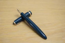 A Parker Duofold Demi aerometric fill fountain pen in green with single gold chevron cap band having