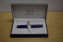 A boxed Parker Duofold Centennial converter fill fountain pen in Lapis lazulii with gold trim having