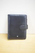 A Montblanc A6 organiser in black leather. Some wear. 15x19.5cm