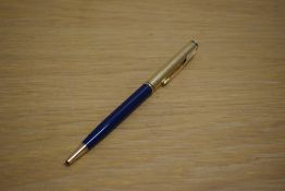 A Parker 75 Insignia ballpoint pen in in blue with custom gold plated cap
