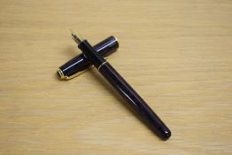 A Parker Sonnet Converter fill fountain pen in laque red with gold trim having Parker nib
