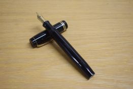A Parker Duofold Senior button fill fountain pen in black with two gold bands to the cap having