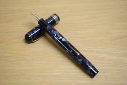 A Conway Stewart 55 lever fill fountain pen in blue black marble with one broad and two narrow cap