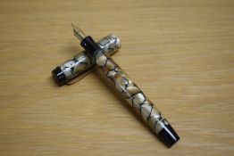 A Parker Duofold Special button fill fountain pen in black and pearl with two gold bands to the