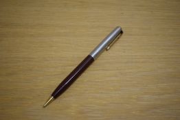 A Parker 51 propelling pencil in Cordovan Brown with lustraloy cap with jewellers band and gold fill