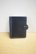 A Filofax Pocket Finsbury model in real black leather 14 x 11cm