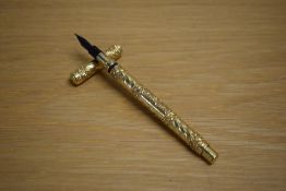 A Mabie Todd & Bard The Swan dipping pen in gold scroll and wave design. engraved AP