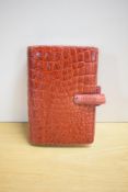 A Filofax Amazona Personal Organiser model in deluxe red leather 19 x 13cm clip broken