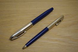 A Sheaffer Imperial VIII touchdown fill fountain pen and ballpoint pen in blue with gold cap