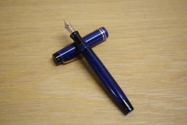 A Parker Duofold Junior Streamlined button fill fountain pen in lapis lazulii with two gold bands to
