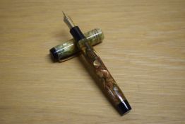 A Parker Duofold Deluxe Special button fill fountain pen in bronze and gold with three cap bands