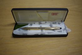 A boxed Cross ballpoint pen in rolled gold stamped 748