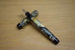 A Parker Duofold Special button fill fountain pen in black and pearl with two gold bands to the