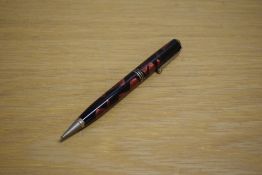 A Parker Televisor Deluxe Challenger propelling pencil in red and black marble