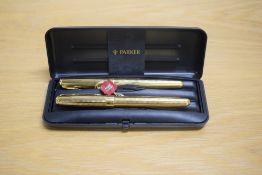 A boxed Parker Sonnet Premiere Cascade converter fill fountain pen roller ball set in gold having