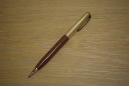 A Parker 51 propelling pencil in tan with rolled gold cap