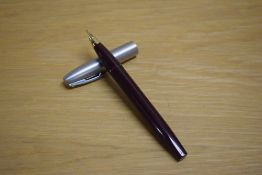 A Sheaffer Imperial Deluxe II touchdown fill fountain pen in burgundy with brushed steel cap