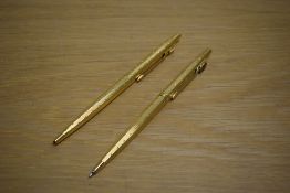 A Parker Classic ballpoint pen and propelling pencil set in rolled gold perle design