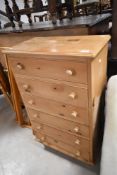 A natural pine chest of six drawers, width approx. 62cm