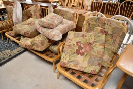 A light Ercol three piece cottage suite