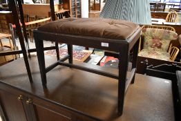 A 19th Century mahogany stool having later dralon covered drop in seat, on square legs and H