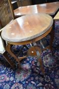 An Edwardian mahogany occasional table having inlaid decoration, shaped leg and circular