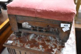 A 19th Century oak footstill with bobbin turned decoration