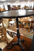 An early 20th Century mahogany occasional wine table, height approx. 69cm