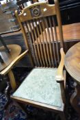 An early 20th Century mahogany rail back carver chair