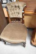 A Victorian mahogany framed nursing chair having later dralon upholstery, with button back and
