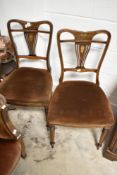 A pair of Edwardian inlaid salon chairs