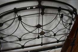 A Victorian style cast iron bed frame, width approx. 4ft 6inches