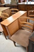A vintage teak G plan Sutherland style drop leaf table and four chairs (chairs for display
