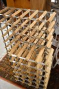 Two classic pine and metal wine bottle racks