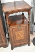 A late Victorian rosewood coal purdonium having inlaid decoration to the drop front with shelf