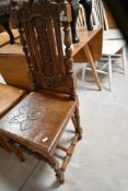 A late 19th or early 20th Century solid seat dining or hall chair