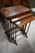An Edwardian mahogany nest of four tables
